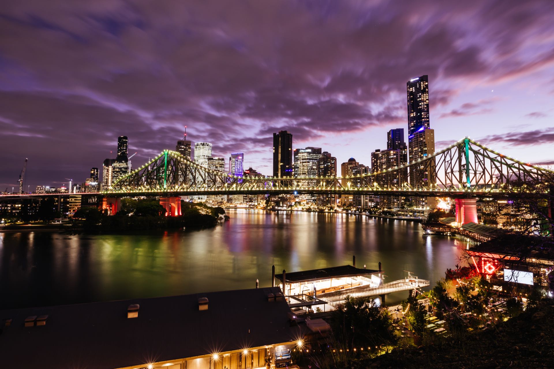 Brisbane skyline and the Story Bridge lit up at dusk